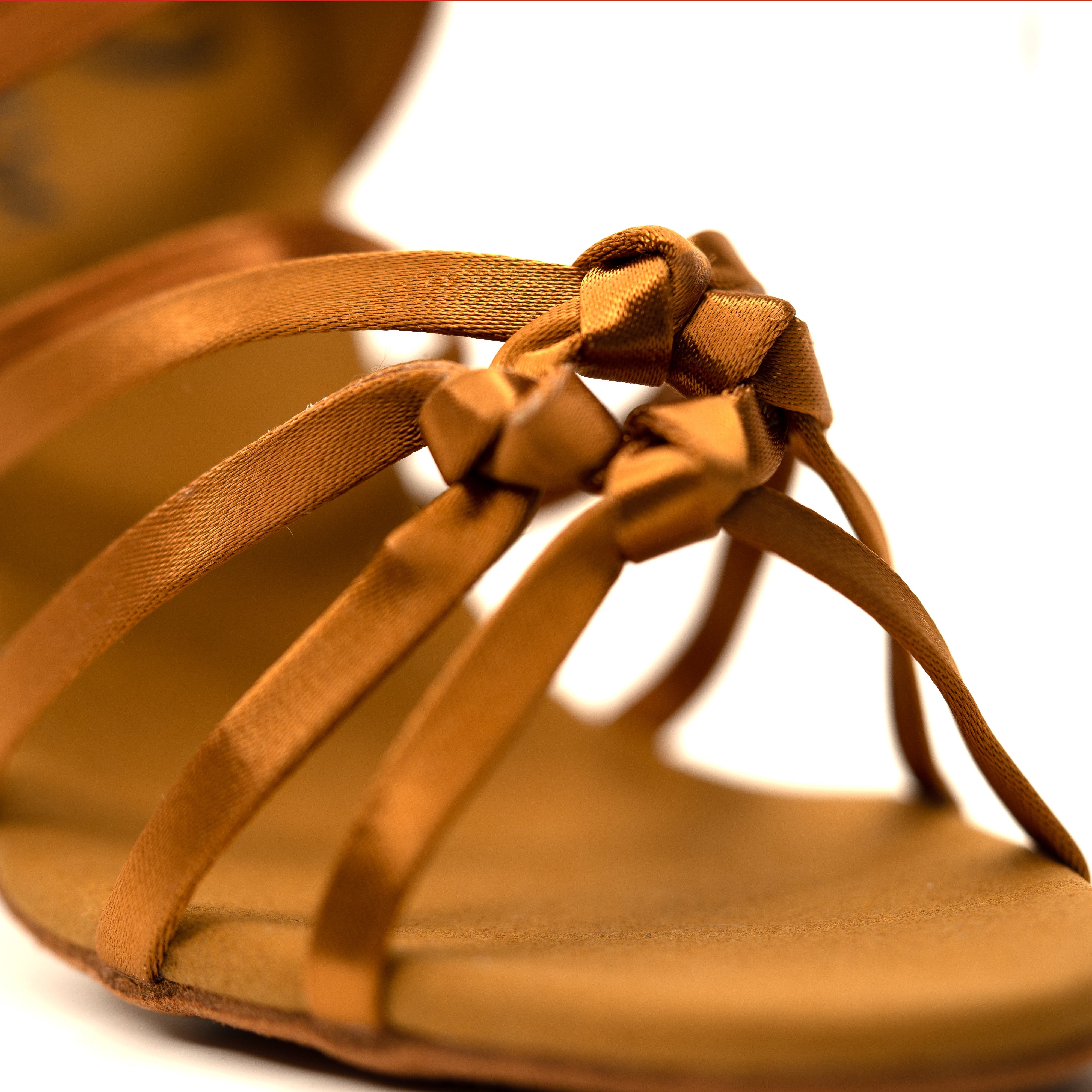 Close up of knot of high heel tan colour shoe